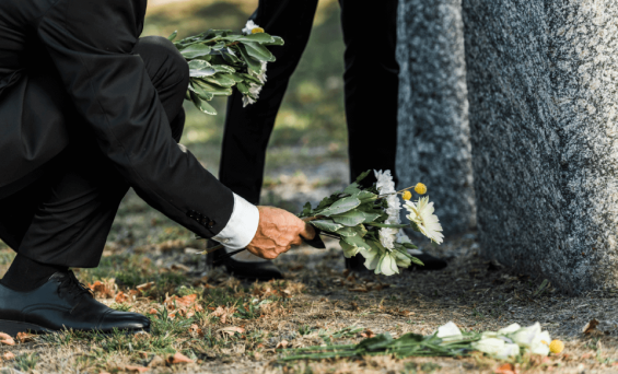 cropped-view-of-senior-man-putting-flowers-near-to-2023-11-27-05-30-34-utc