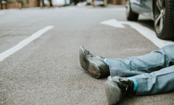 person-lying-on-the-ground-after-a-car-accident-2023-11-27-04-53-28-utc (1)
